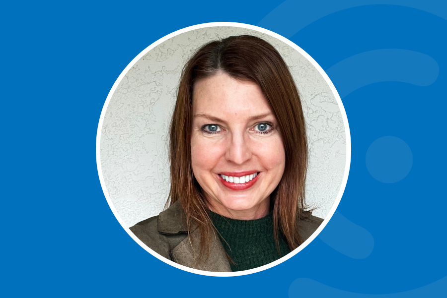 Laura Beatty headshot on a blue background